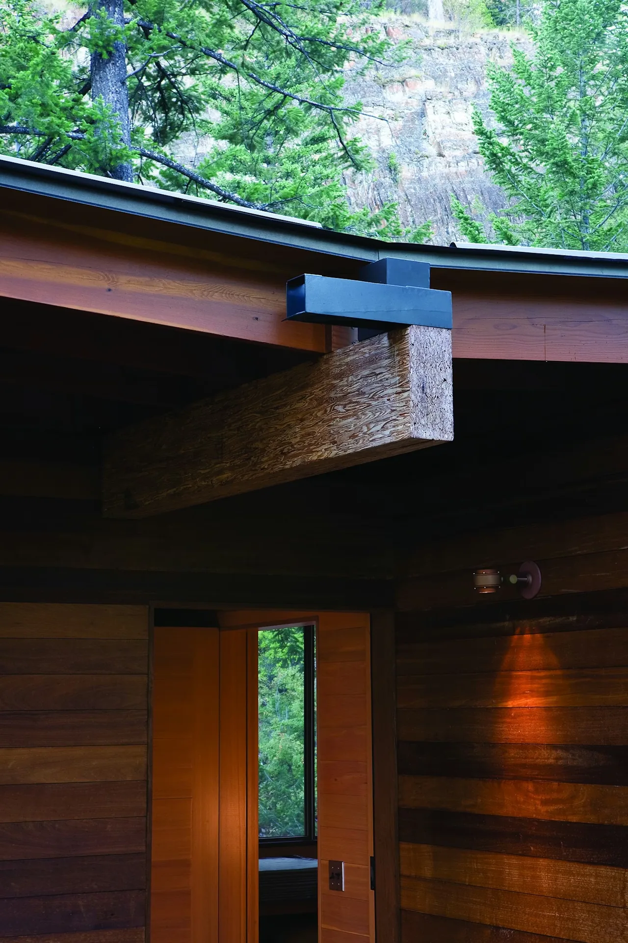 Exterior detail of timber beam and wooden siding on Cabin on Flathead Lake by Andersson Wise Architects.