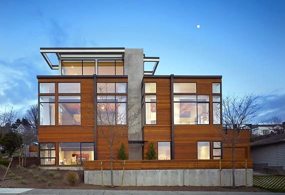 Sunset Hill house with wood siding and black window frames by Studio Ectypos in Seattle.