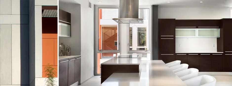 Klugness residence kitchen features dark cabinetry and a sleek stainless steel range hood by Baldinger Studio in Phoenix.