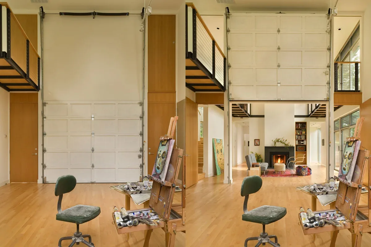 The Geist Residence features an art studio with a large garage door opening to a living room with a fireplace and extensive glazing.