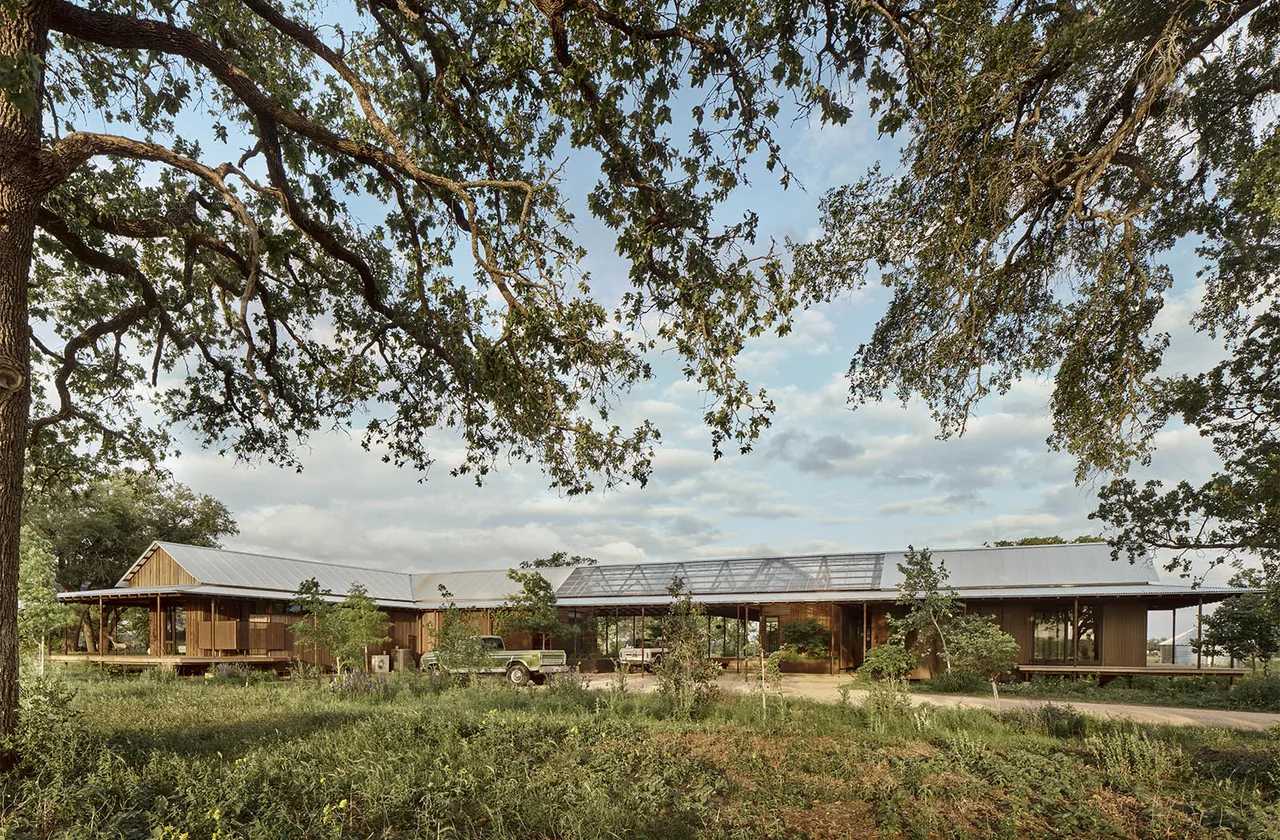 Roam Ranch features a low-profile modern design with metal roofing and extensive landscaping.