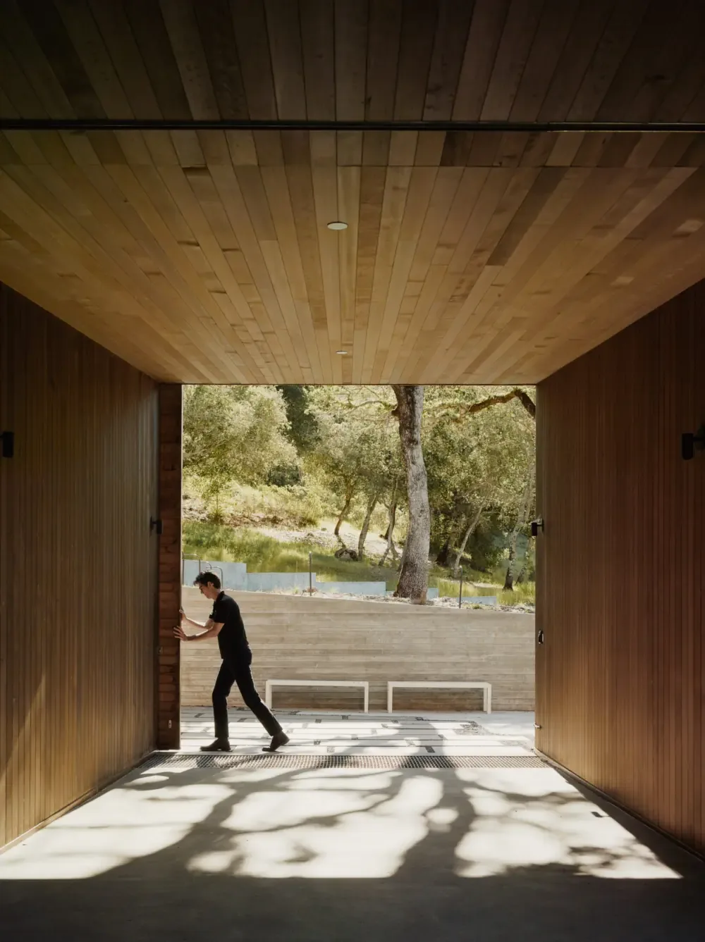 The Valley of the Moon Retreat features a covered outdoor passage with wood paneling and views of natural terrain.