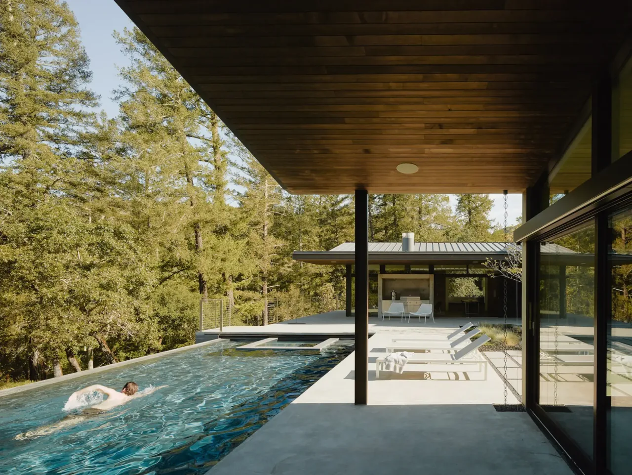 Valley of the Moon Retreat features a pool area with adjacent covered patio and forest views.