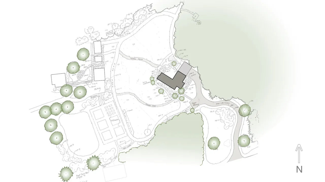 Site plan of Acorn Acres project showing house footprint, driveway, paths, and surrounding trees.