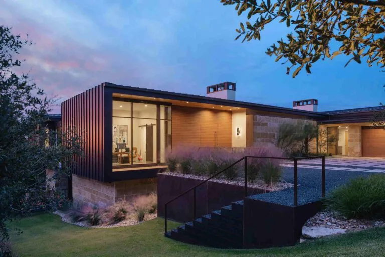Laceback Terrace features a modern exterior with large glass windows and mixed materials by James D. LaRue Architecture.