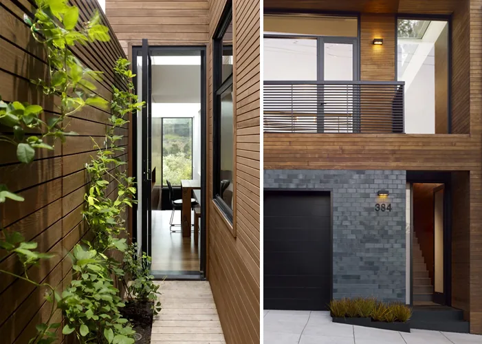 Courtyard features wood siding, planter, and floor-to-ceiling glazing next to a modern garage and entrance with stairwell.