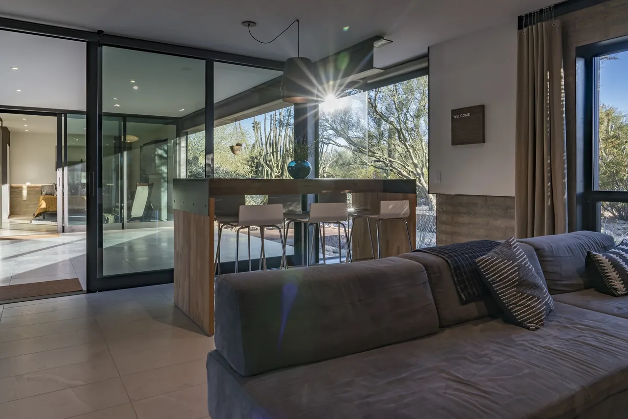 The 4018 casita features large glass doors connecting the living space with desert surroundings in Phoenix.