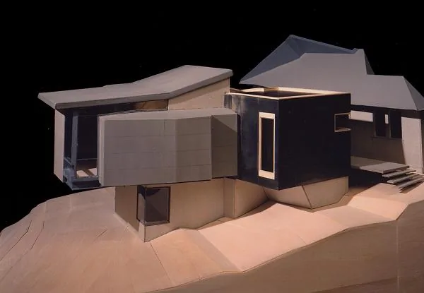 Model of 'Half-life House' showing a modern design with flat roofs, cantilever, and large window openings.