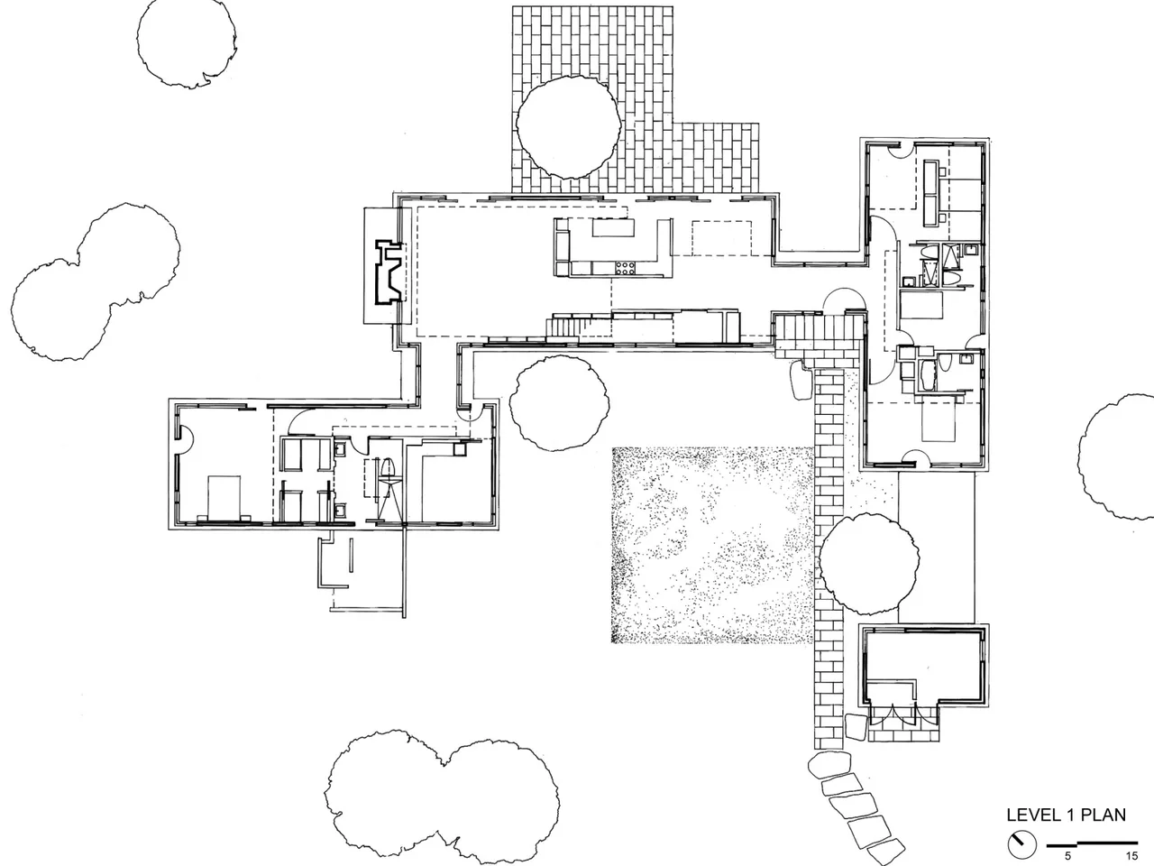 First level architectural floor plan of the Long Island House by Tod Williams Billie Tsien Architects showing room arrangement and pathway layout.