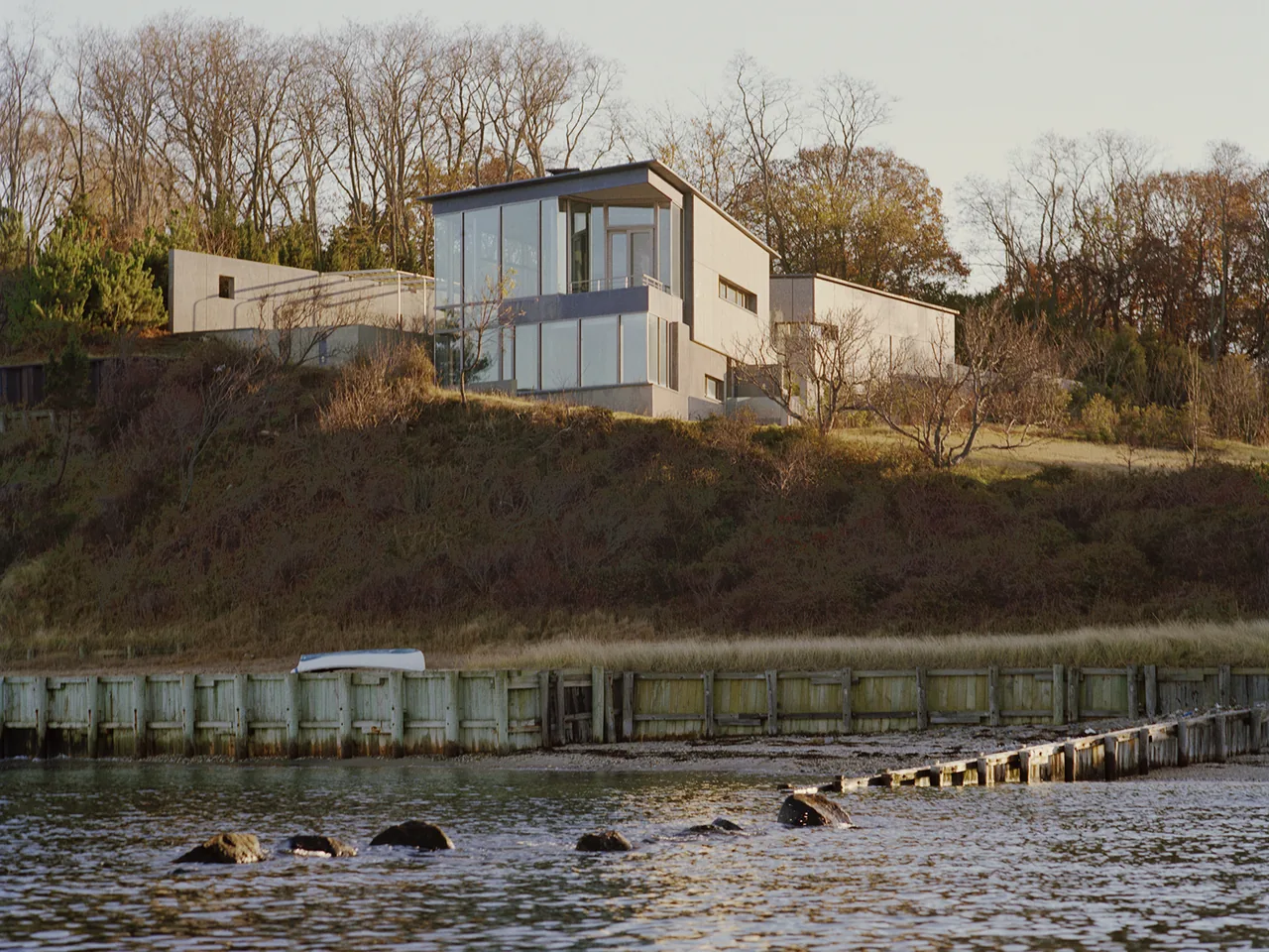Shelter Island House by Tod Williams Billie Tsien Architects features large floor-to-ceiling glazing with a flat roof.