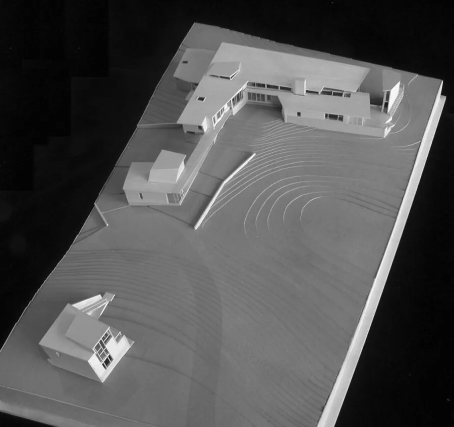 Architectural model of Orleans House in Cape Cod showing multiple buildings linked by stairs over a contoured site.