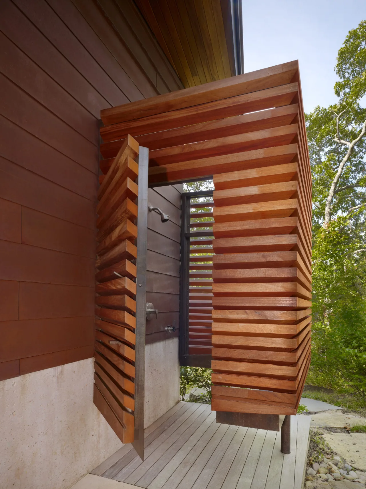 The Chilmark Guest House features an outdoor shower with a wood slat enclosure.