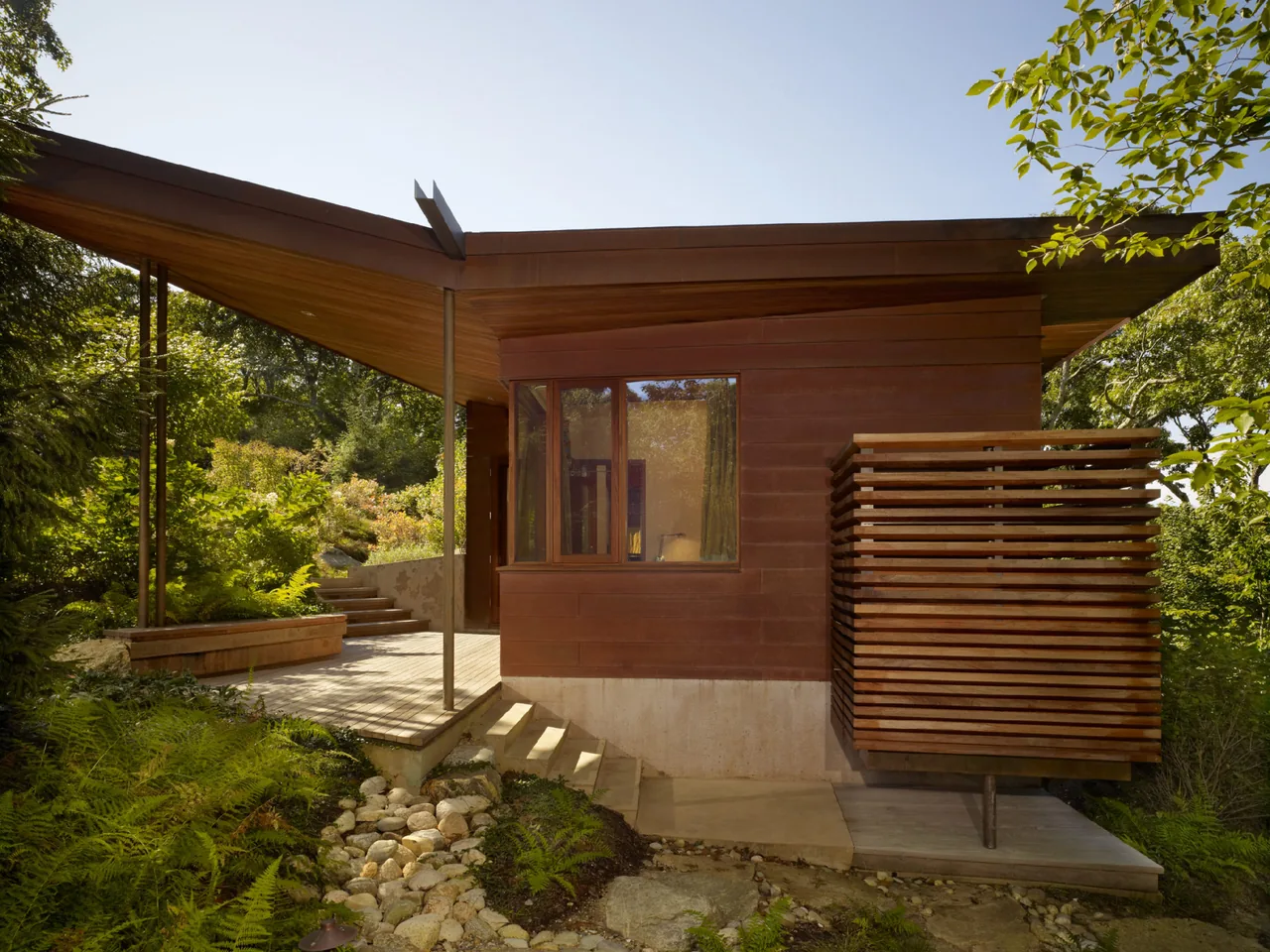 Chilmark Guest House features a cantilevered wood slat detail and prominent angular roof by Charles Rose Architects.