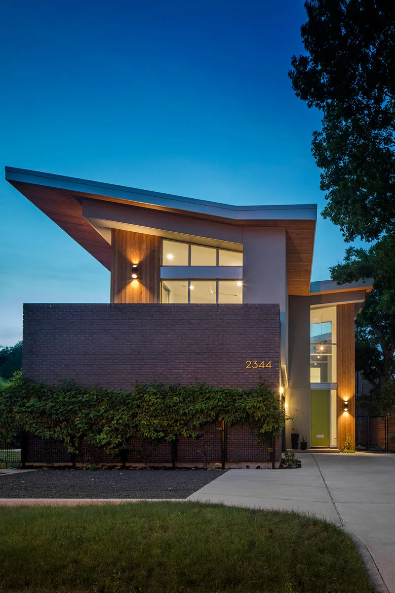 HOUSE 2344 by Collaborative Design Works features large glazing and an angled roof in Houston.