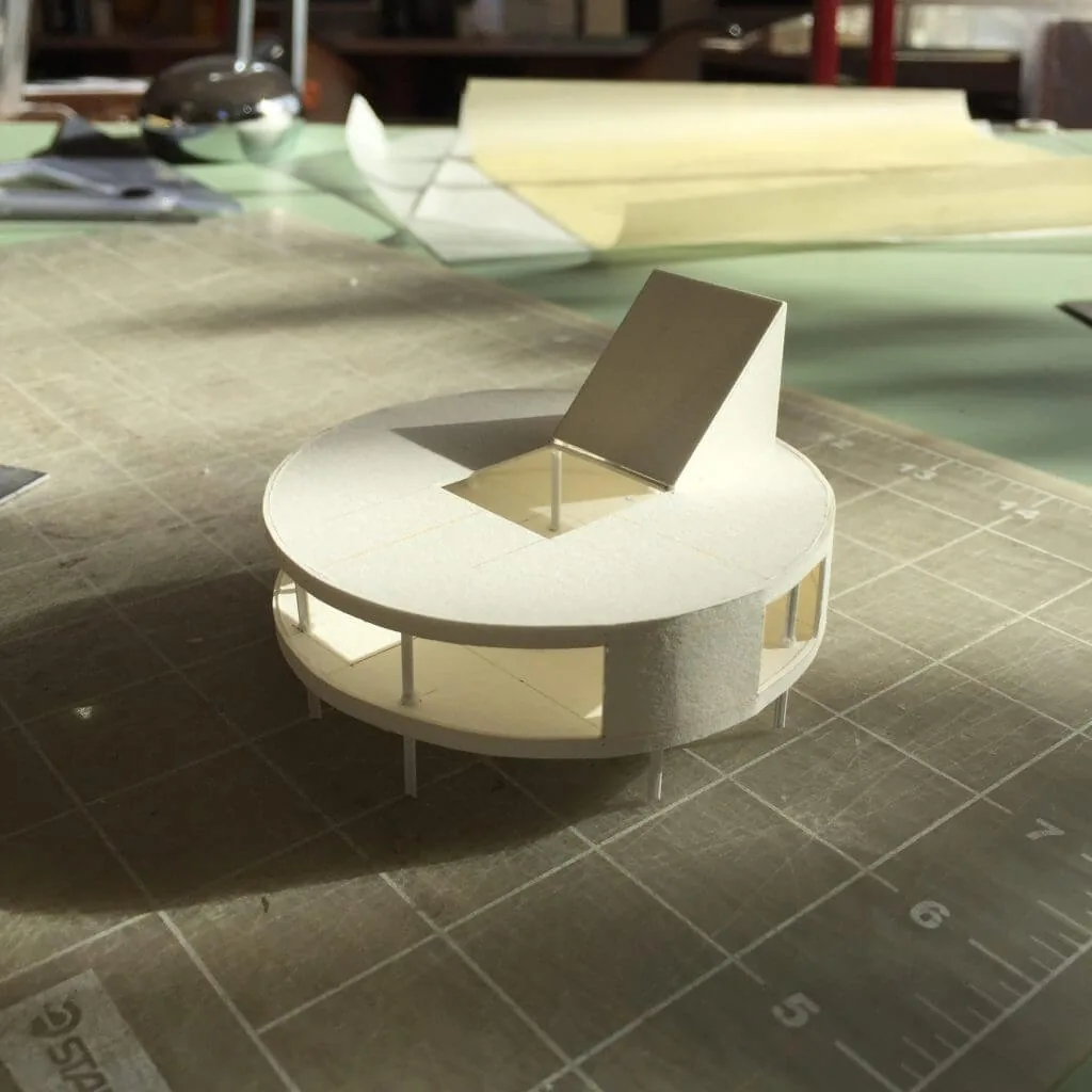 Architectural model of the D Fin House showing a circular plan and a raised roof element.