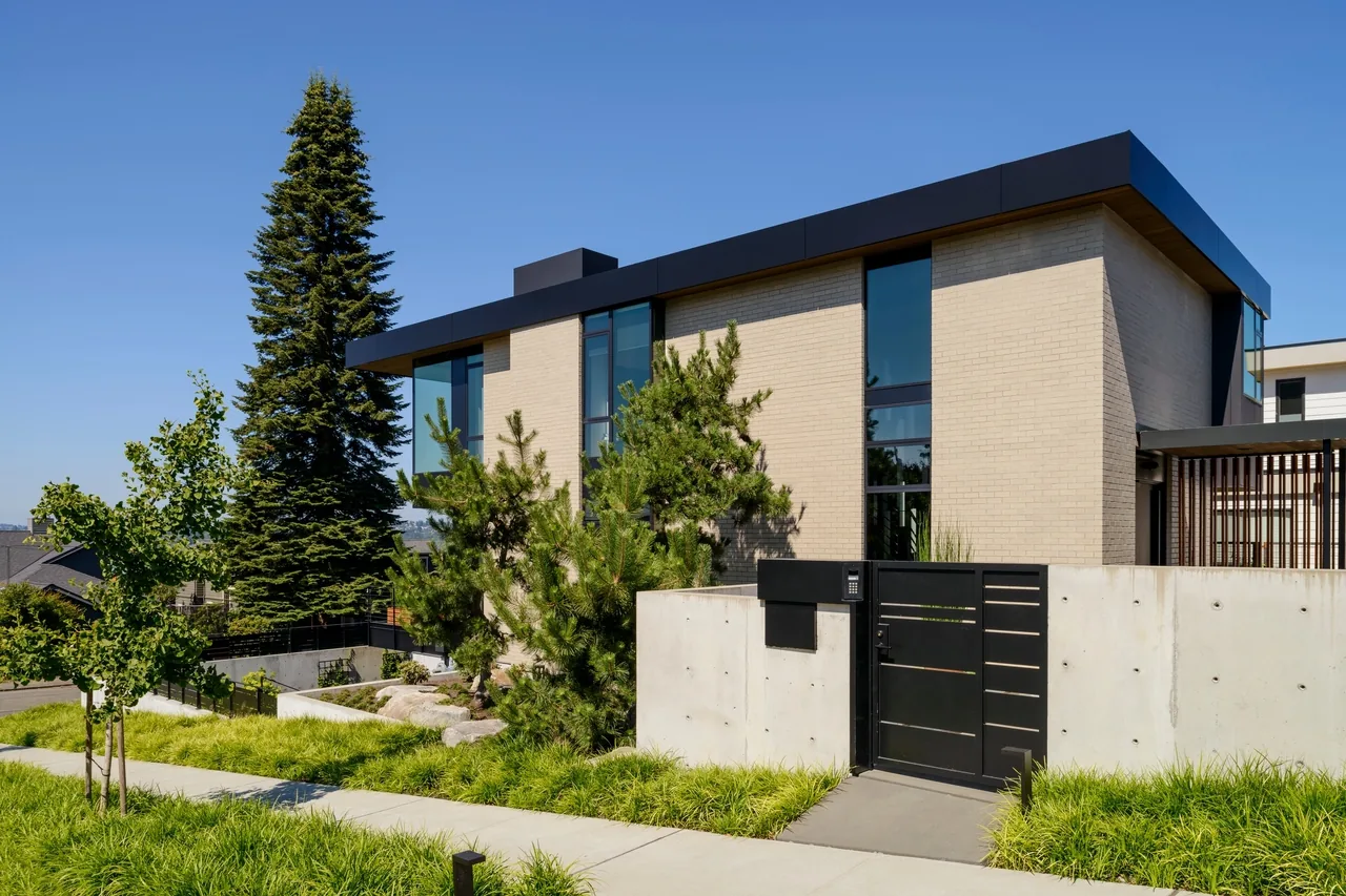 West of Market features a modern beige brick exterior with flat roof and black window frames.