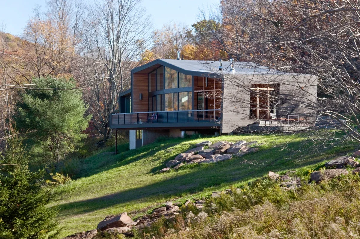 Quail Ridge House by David Weiner Architects features a modern design with a large deck on a hilltop site.