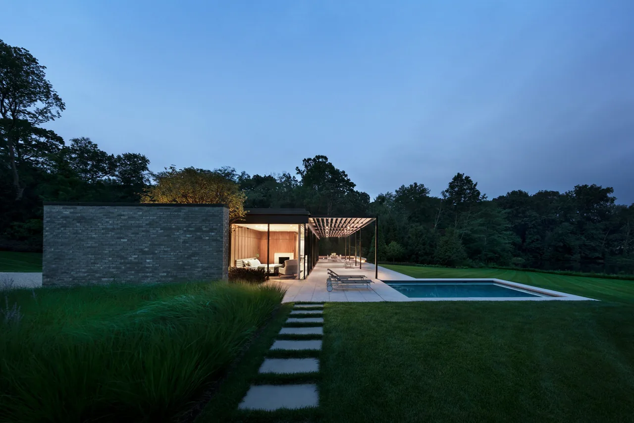 New Canaan Pavilion features an outdoor living area with pergola and pool, designed by Deborah Berke & Partners in New York.