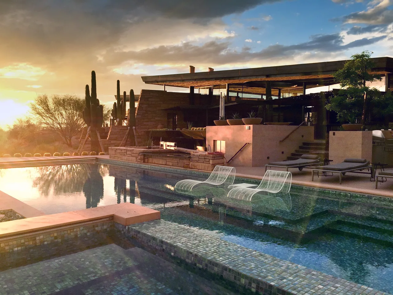 Saguaro Ridge features a modern desert home with a pool and seating integrated into the water area.