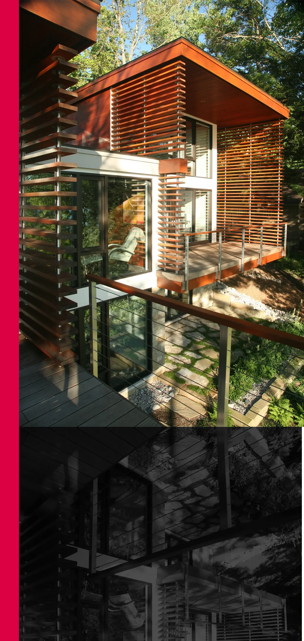 Walloon Lake House balcony features wood slat screening and metal railing blending with the wooded site.