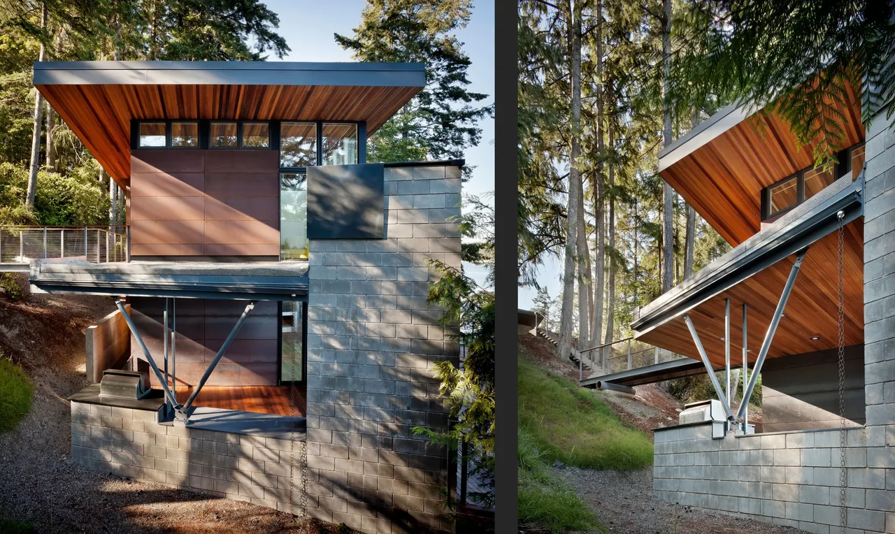 Herron Island Cabin features a cantilevered roof with wood siding over a concrete block base, situated in a wooded area.