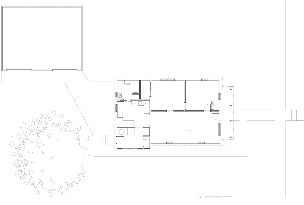 Floor plan showing the layout of a small residence with two bedrooms, bath, and living space.