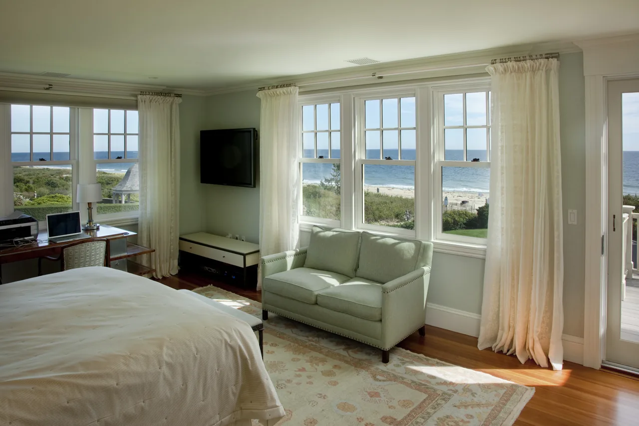 Watch Hill Rhode Island Residence bedroom with ocean views and large windows by Hammer Architects.