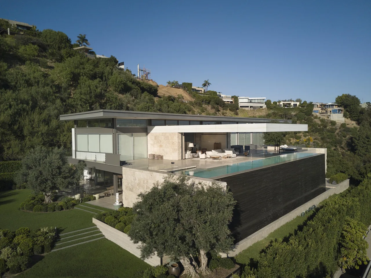 Hollywood Residence featuring a cantilevered design and rooftop infinity pool by Horst Architects in Los Angeles.