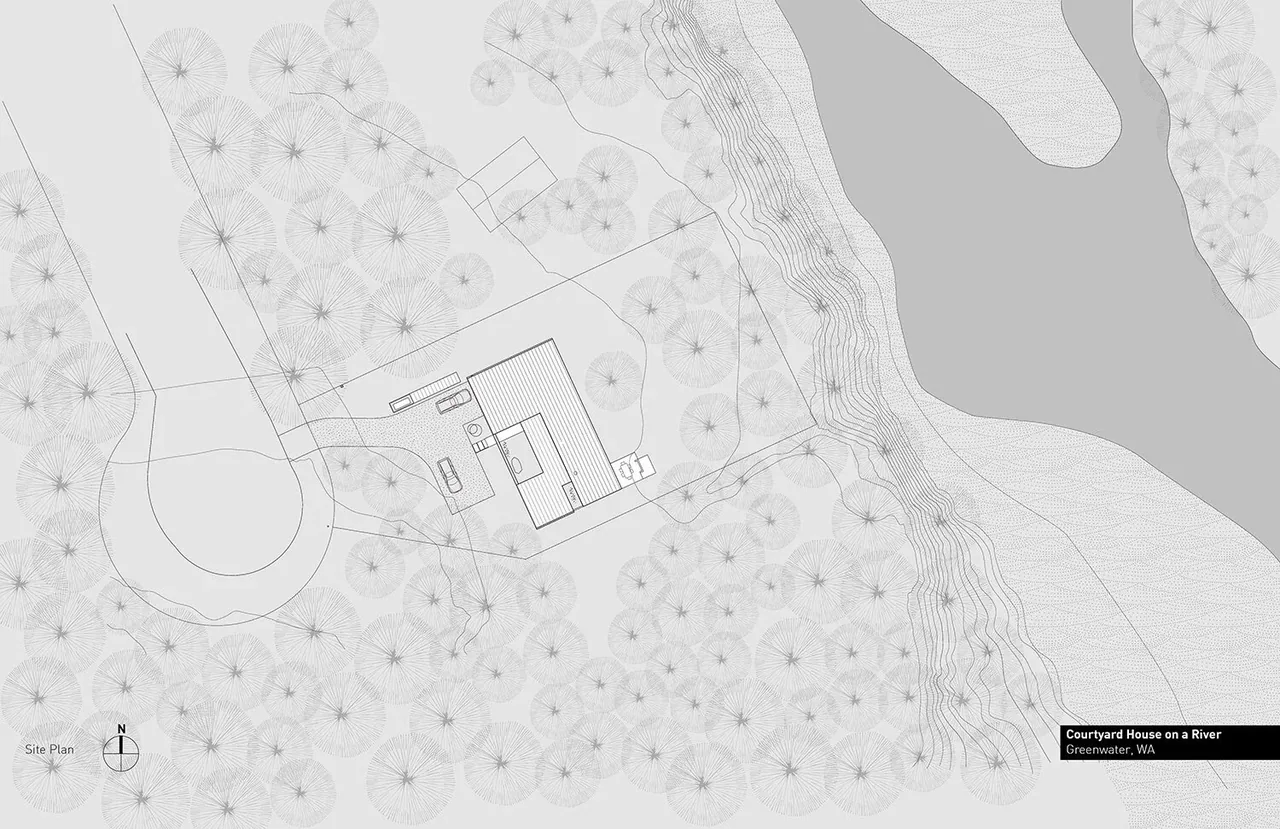 Site plan showing the Courtyard House on a River situated near a river with surrounding wooded area and topography.
