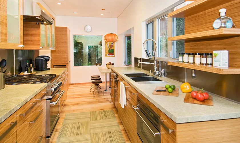 Kitchen features wood cabinets, stone countertops, and a professional-style gas range with stainless steel appliances.