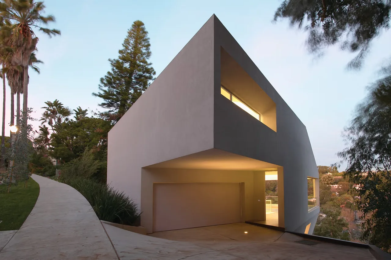Hill House by Johnston Marklee features a minimalist rectangular form with cantilever and large windows in Los Angeles.