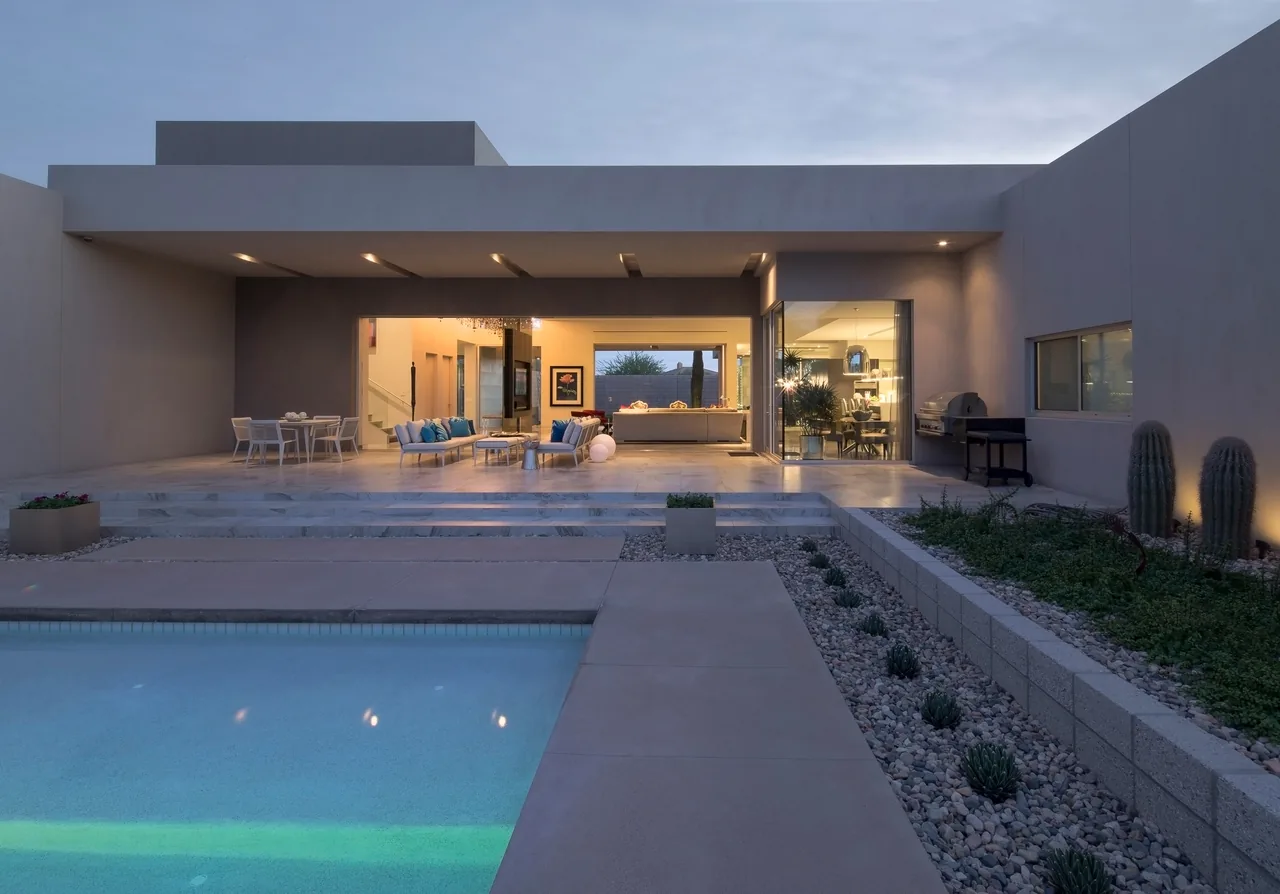 Birds Nest Residence features a modern exterior with an open patio and pool, designed by Kendle Design Collaborative in Phoenix.