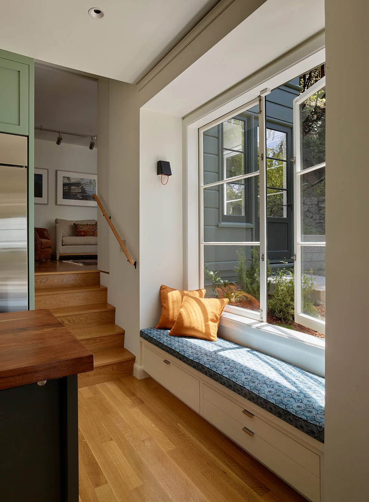 Window seat with storage under a casement window in the Claremont Canyon Residence by Kuth Ranieri Architects.