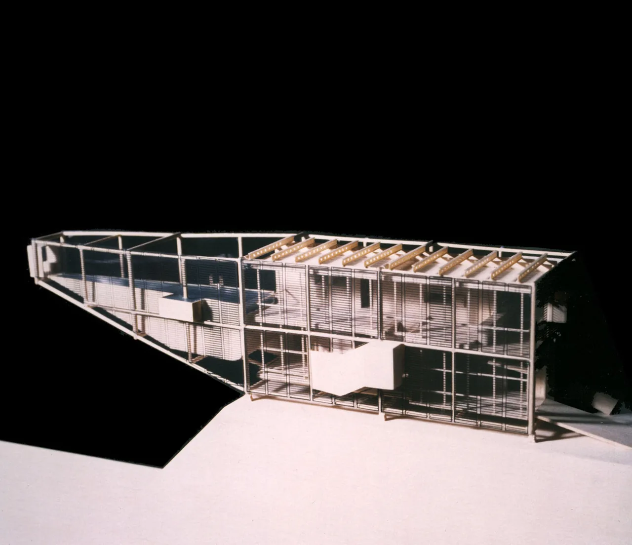 Model of the Claremont Canyon Residence showing a modern design with glass walls and exposed wood roof beams.