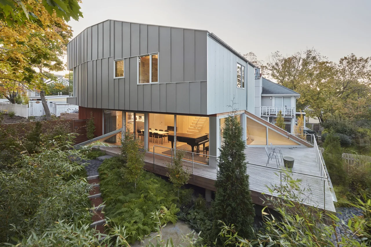House II by Kyu Sung Woo Architects features a modern design with a metallic facade and expansive deck in Boston.