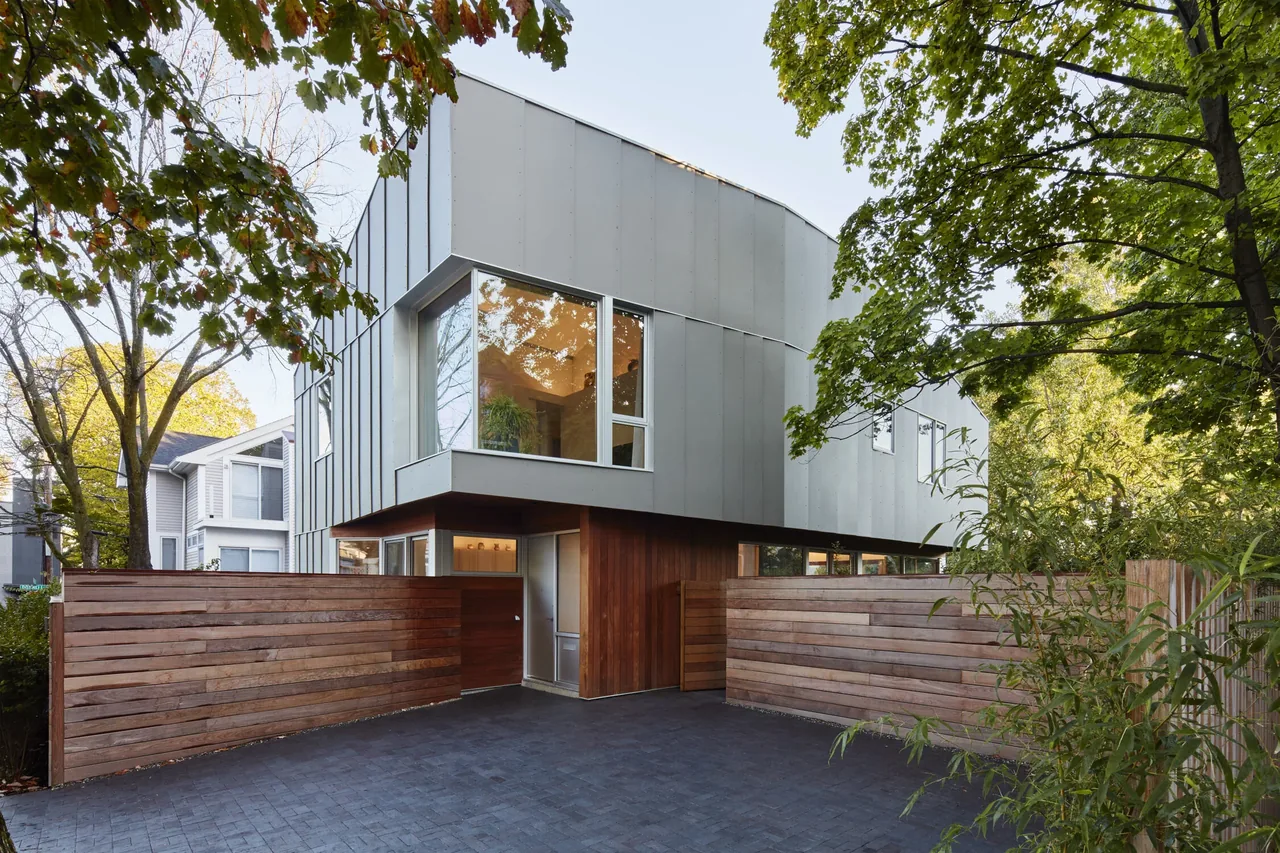 House II by Kyu Sung Woo Architects in Boston features a metal-paneled upper exterior and wood-paneled lower exterior with large windows.