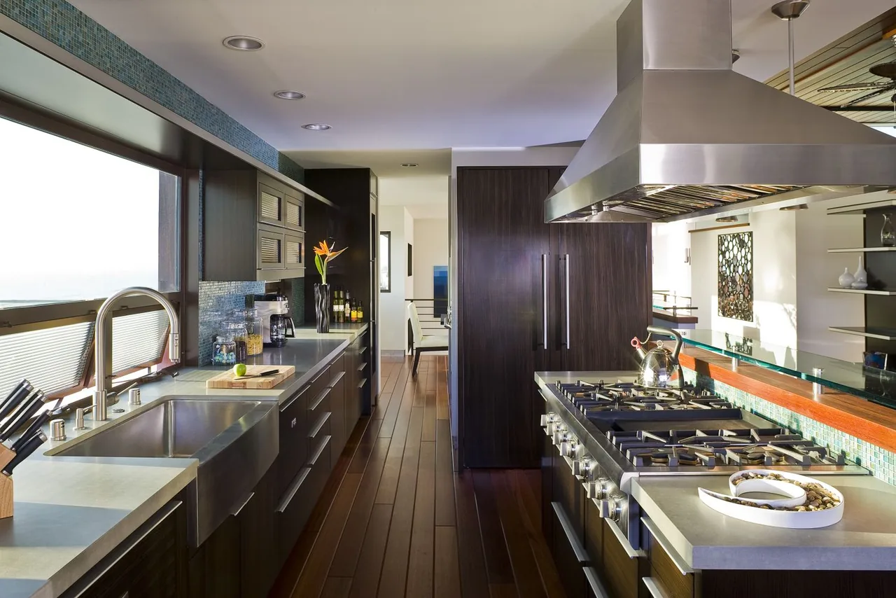 35th Street kitchen featuring dark wood cabinetry and a stainless steel gas range by Lazar Design/Build in Los Angeles.