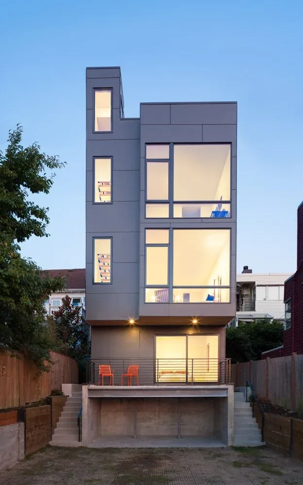 The 18th Ave project features a modern multi-story exterior with large windows and a raised patio area.