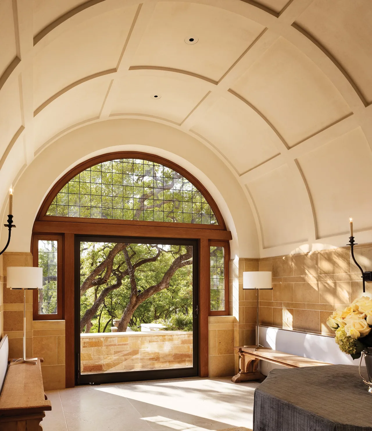 The Turnberry project features a vaulted ceiling and an arched wooden frame with divided lite windows.
