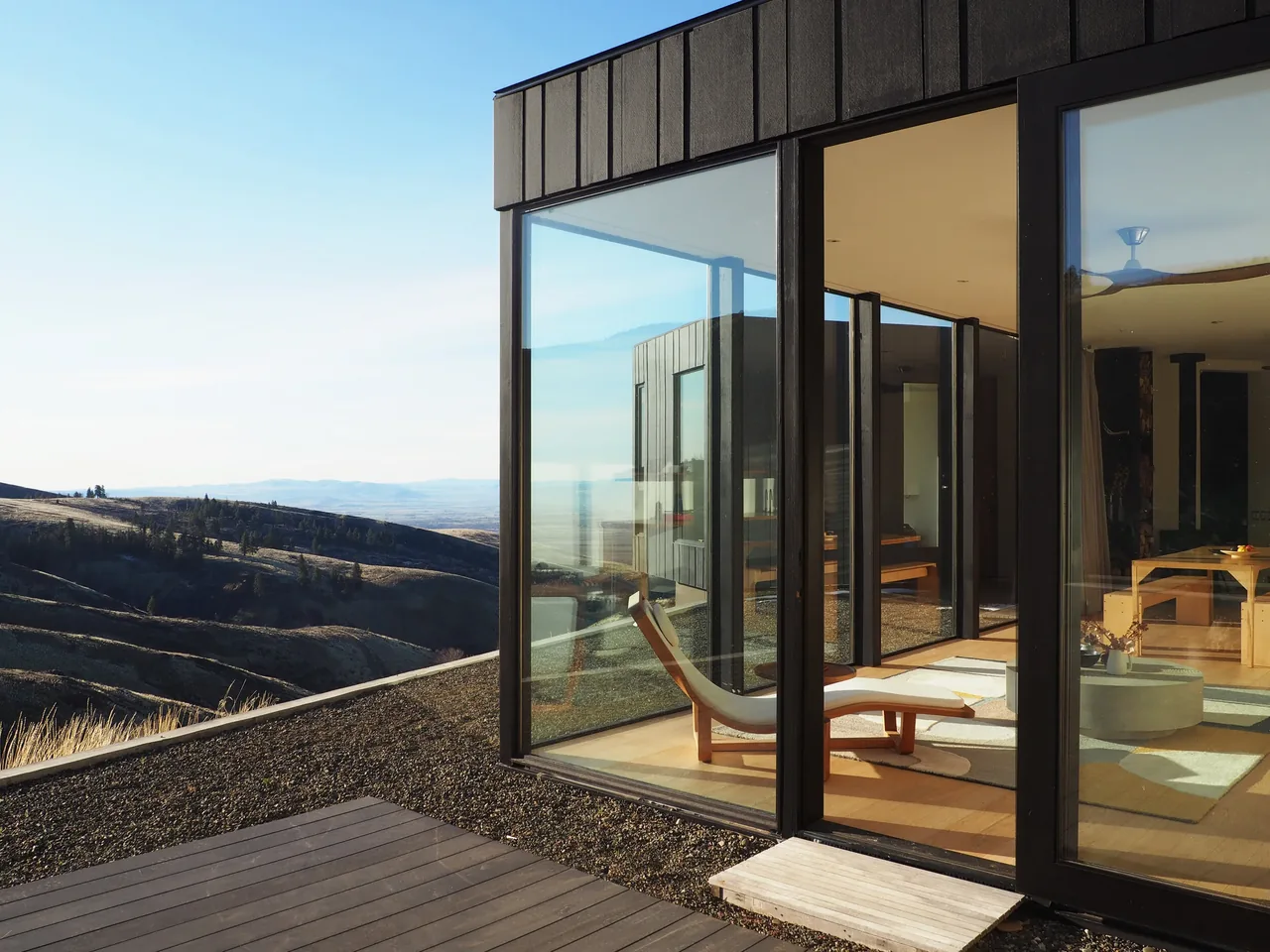 Basalt Canyon Shelter features floor-to-ceiling glazing at the corner to frame views of the surrounding hills.
