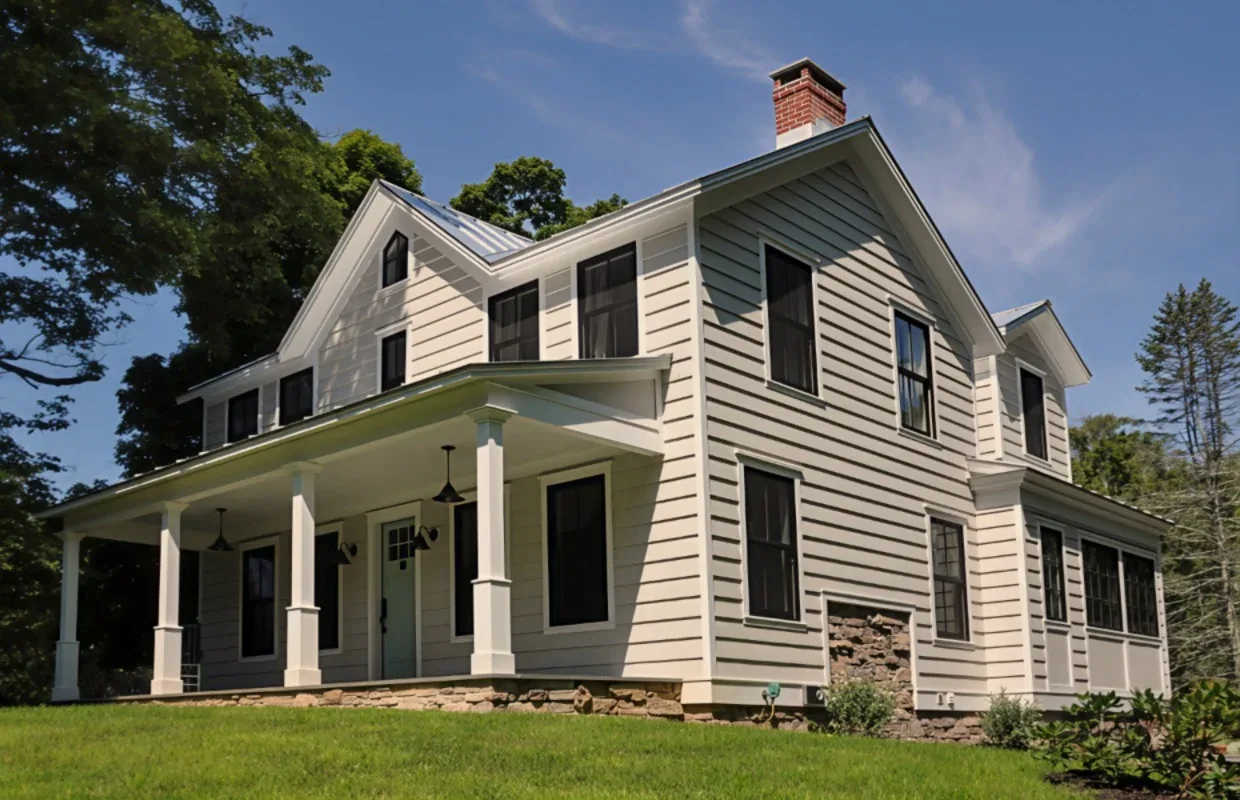 Exterior front view of a traditional two-story house with a gable roof and covered porch.
