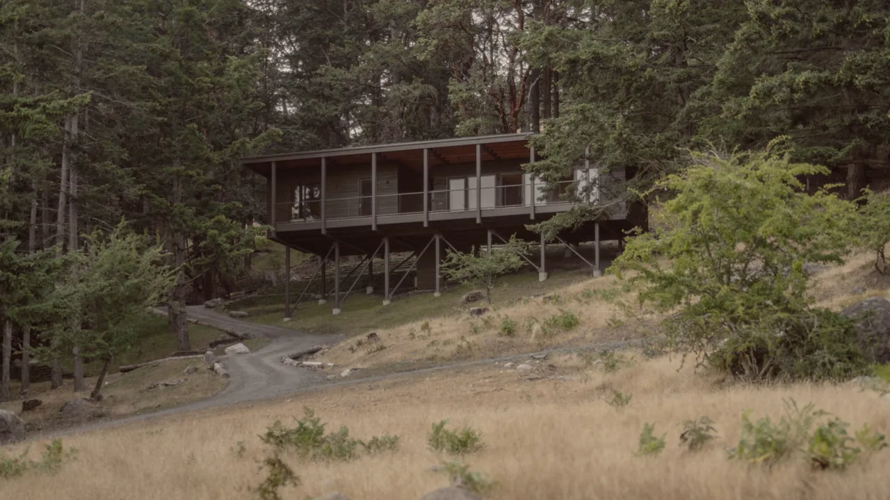 The Trestle Cabin on Decatur Island is an elevated single-family home surrounded by forest.
