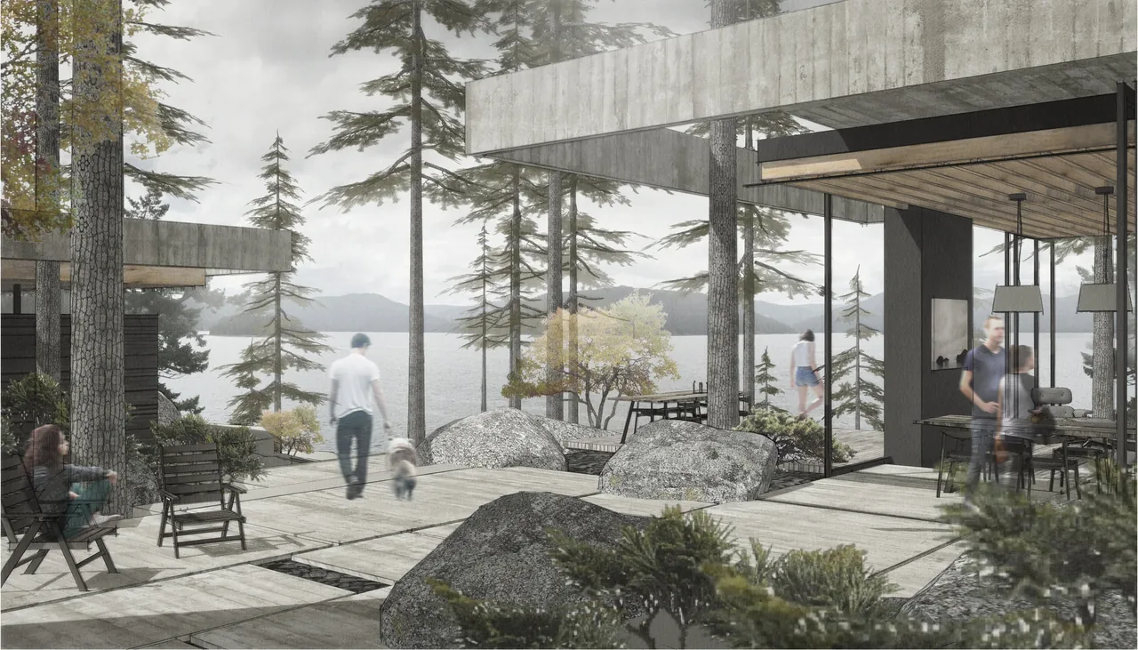 Outdoor patio deck with wooden flooring and stone boulders overlooking a lake and forest setting.