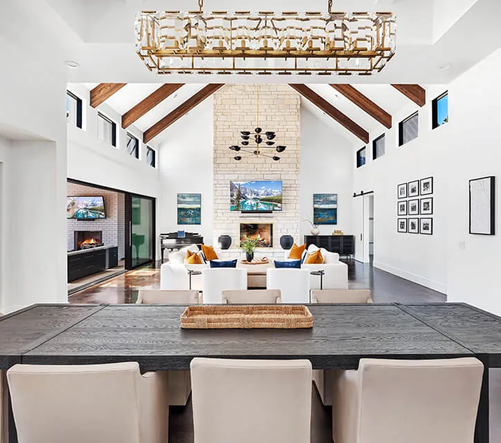 Living room with vaulted ceiling and exposed wooden beams in the BURTON NEW CUSTOM BUILD by Nordby Design Studio.