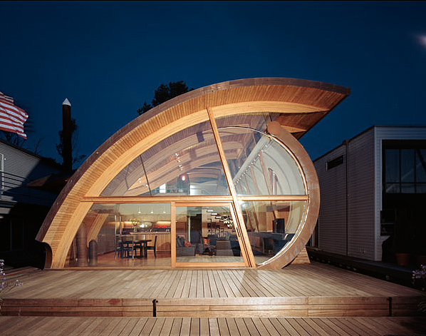 Fennel Residence features a curved wood ceiling and floor-to-ceiling glazing in its exterior front design.