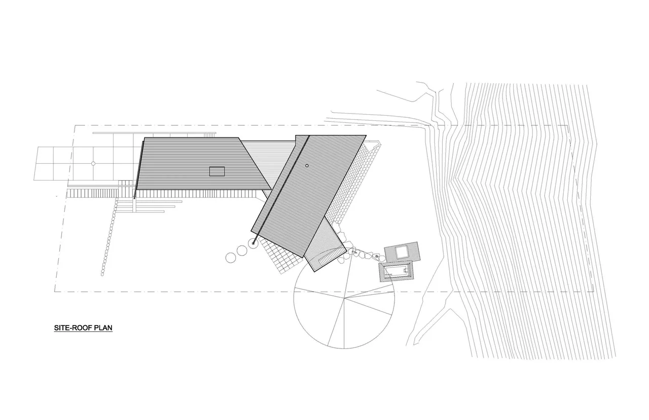 Roof plan for the Y House showing the layout of two angled roofs and site topography lines.