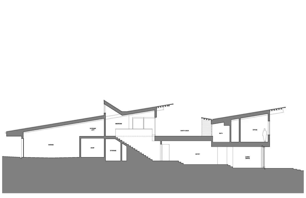 Section drawing of Y House depicts interior layout with angled roof and multiple levels.