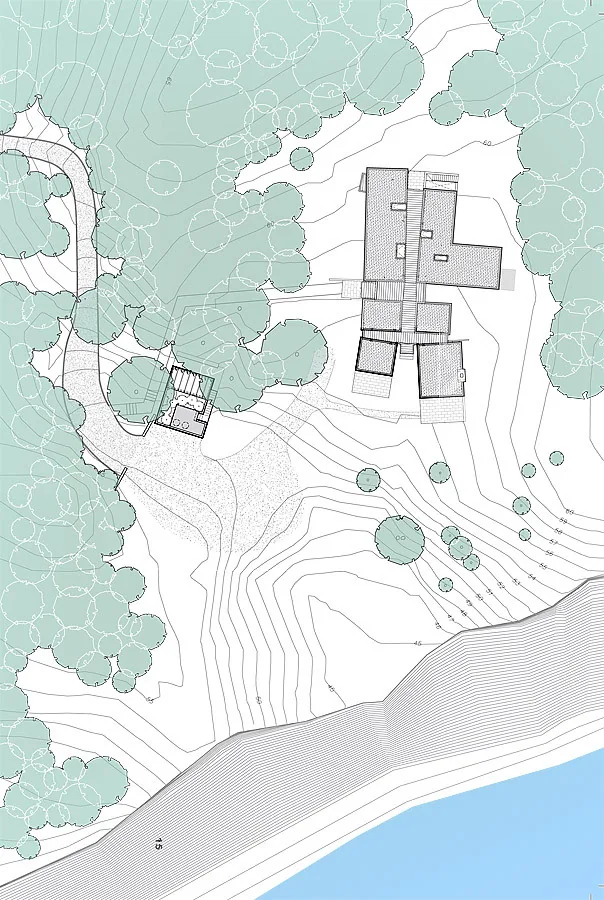 Site plan of East House with surrounding landscape and topography near water edge.