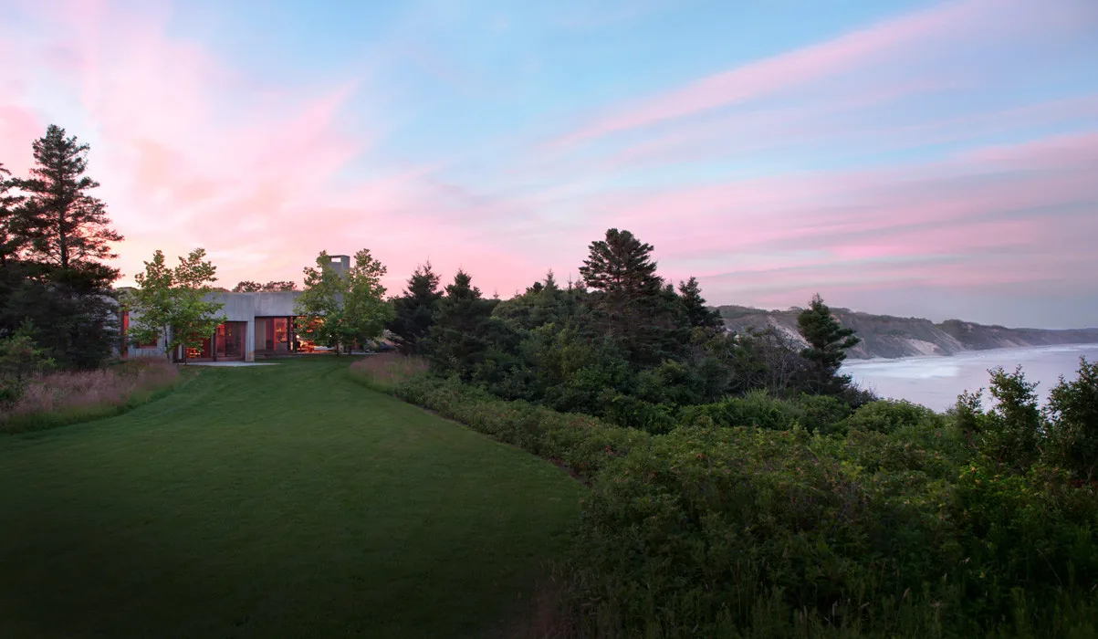 East House by Peter Rose + Partners sits low on the landscape with large glazing facing a scenic waterfront near Boston.