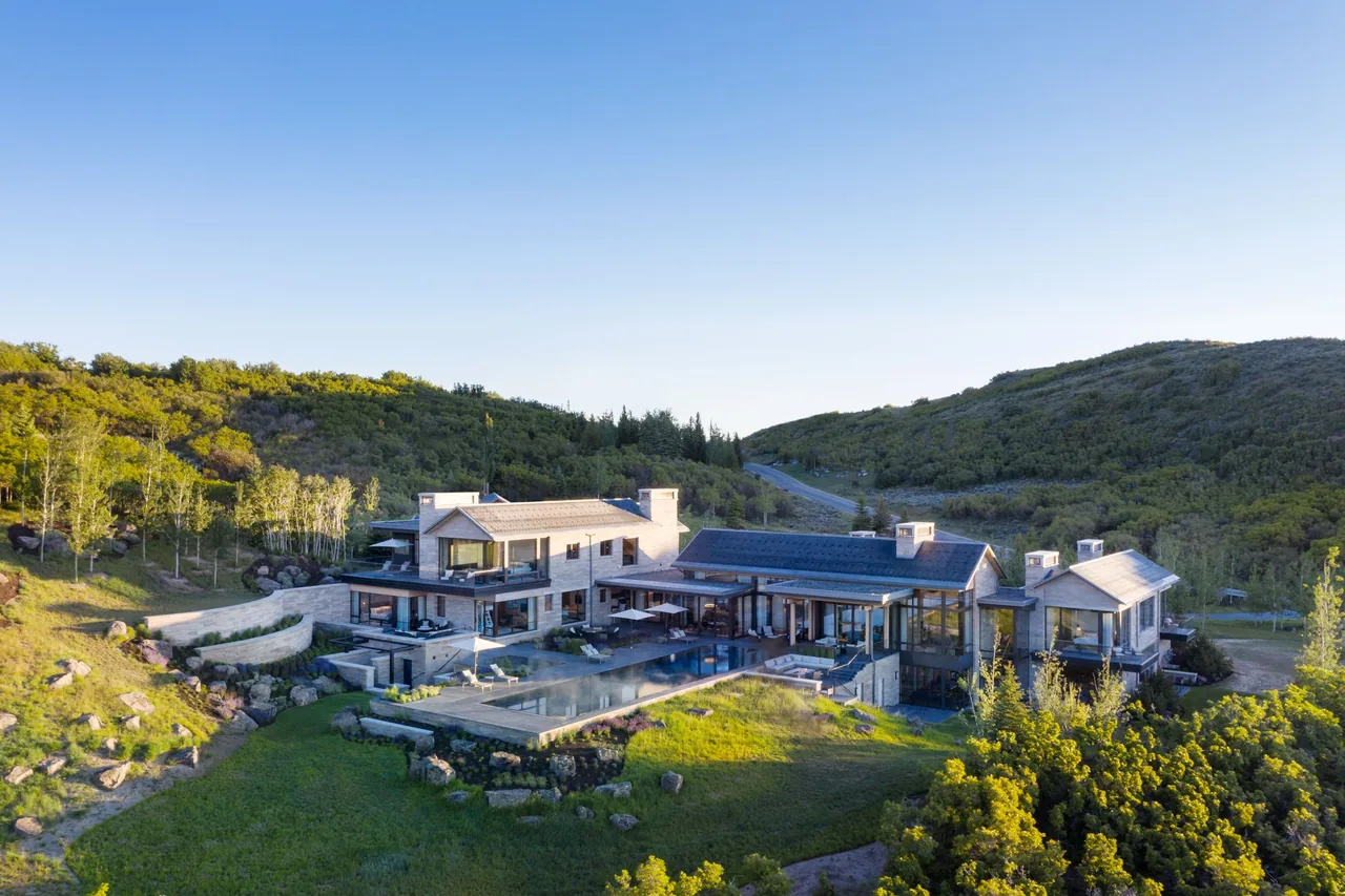 Morning Star Residence features a rectangular infinity pool and outdoor lounge area against a hillside backdrop.